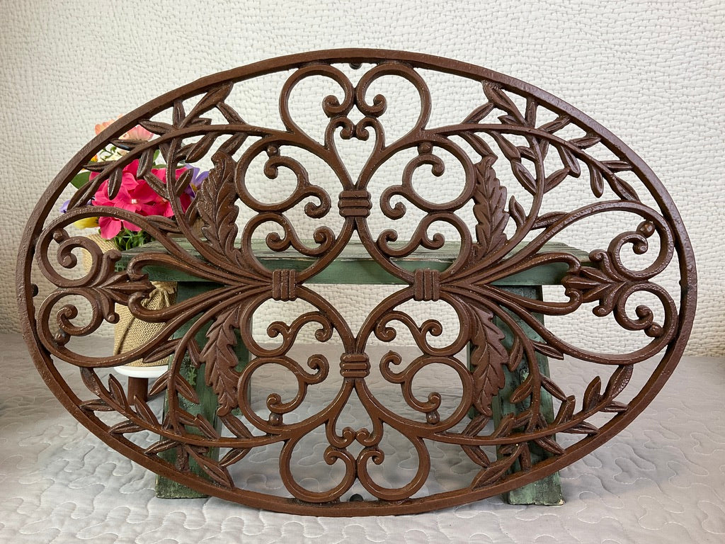 Large Brown Oval Iron Trivet